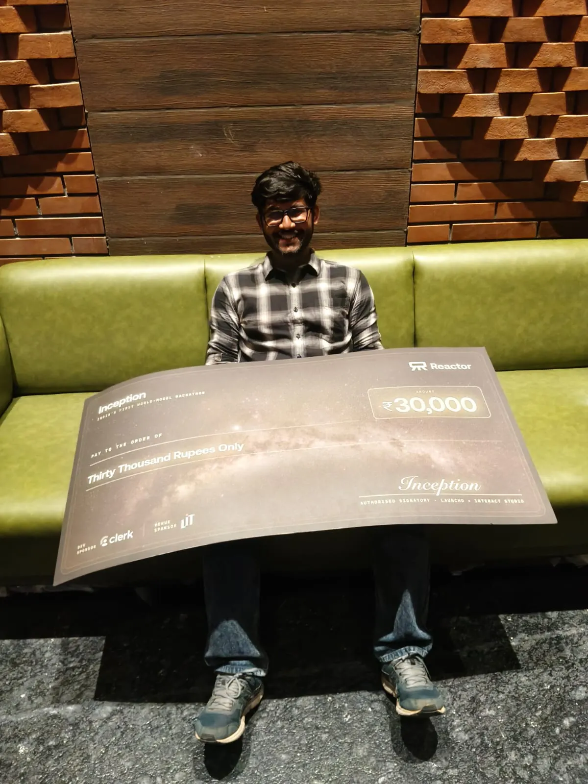 Ujesh with the Inception winner's cheque